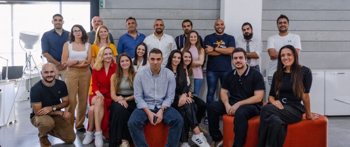 The Moving Doors team photographed together in their office